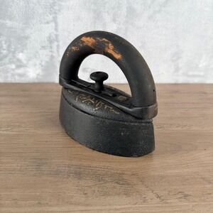 Antique Cast Iron Sad Iron with Wooden Handle and Gold Floral Accents Black